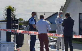 Police outside the Queen Street house, in the suburb of Parkside, Timaru.