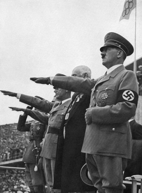 German chancellor Adolf Hitler gives the Nazi salute during the opening ceremony of the Berlin Olympics 1 August 1936.