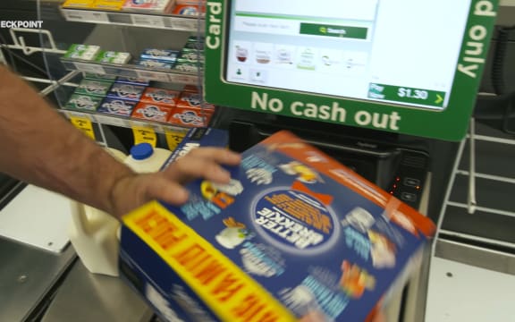 A student sees how much cereal and milk can be bought with $25.