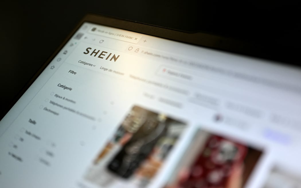 (FILES) This photograph shows the Asian e-commerce giant Shein website page on a laptop in Paris on November 5, 2025. On December 19, 2025, the Paris Court of Justice rejected the government's request for a temporary block on the Shein website in France, ruling that the measure was ‘disproportionate’ after the Asian e-commerce giant voluntarily withdrew the illegal products it was selling. (Photo by Julie SEBADELHA / AFP)