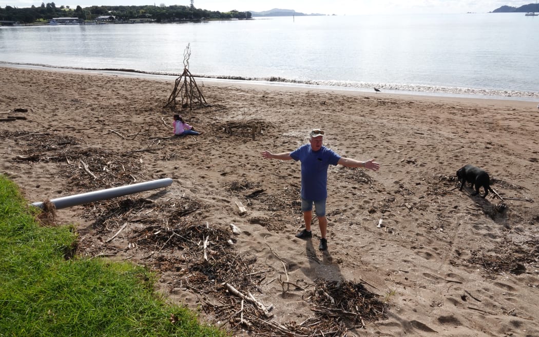 Long-time Paihia resident Ross Robertson inspects the disappearing Waitangi waterfront.