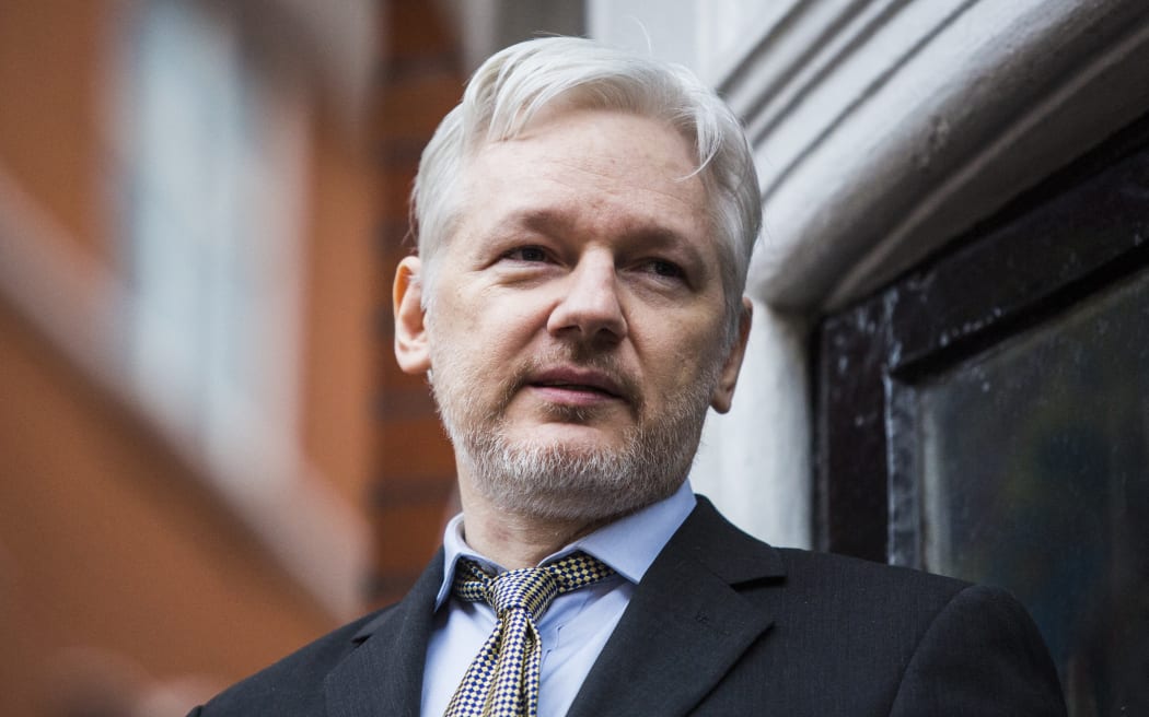 WikiLeaks founder Julian Assange addresses the media from the balcony of the Ecuadorian embassy in central London on February 5, 2016.