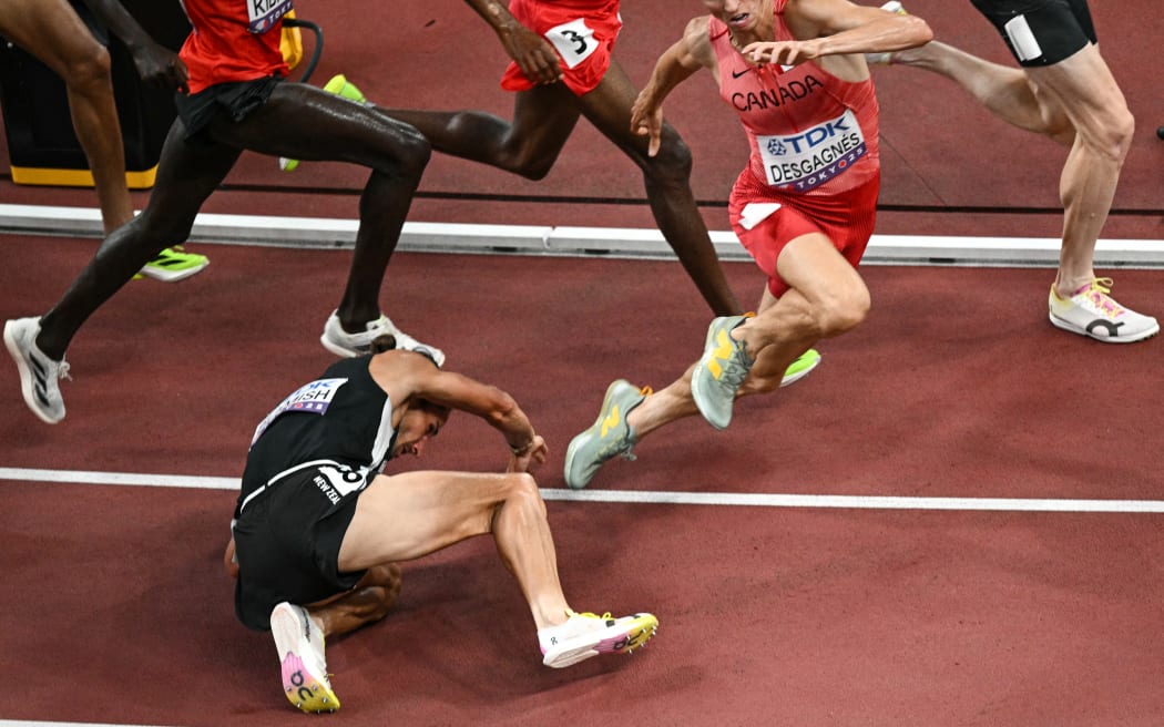 New Zealand's athlete Geordie Beamish falls in the men's 3000m steeplechase heats during the World Athletics Championships in Tokyo on September 13, 2025. (Photo by Philip FONG / AFP)