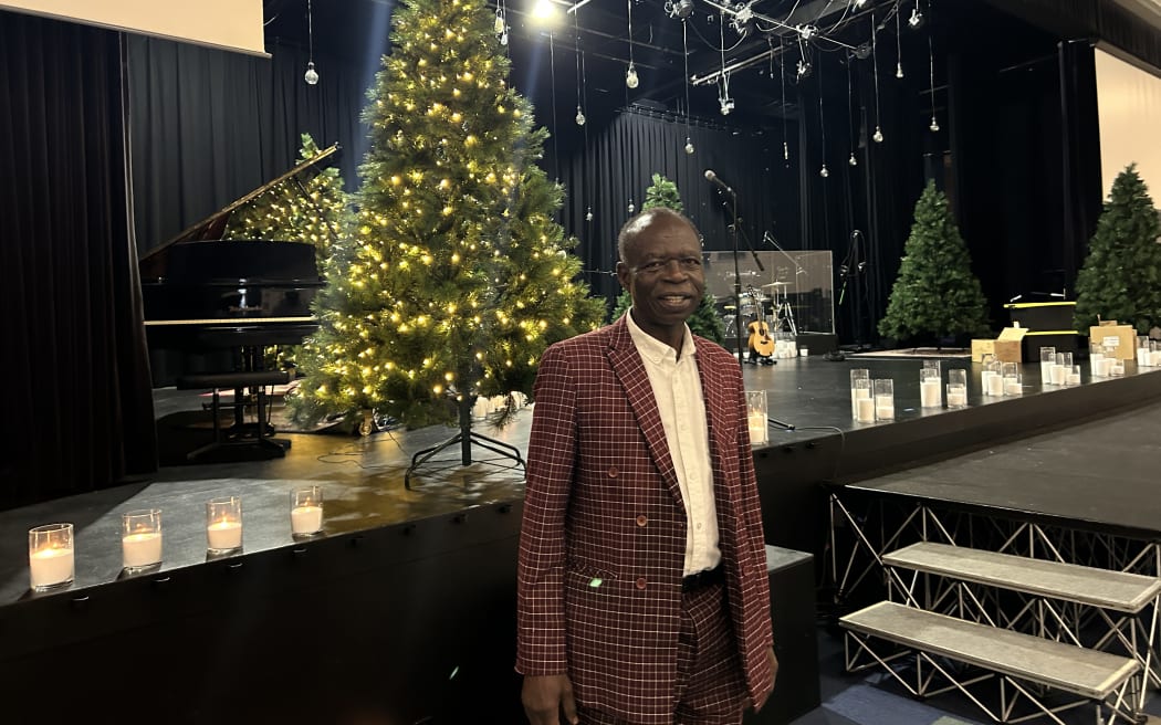 Photo of a man smiling at the camera