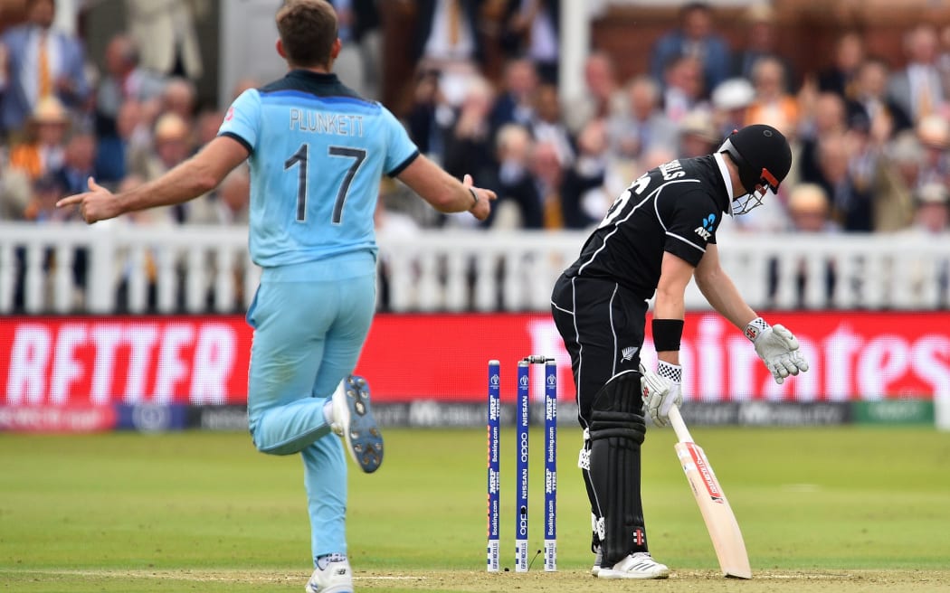 England's Liam Plunkett celebrates taking the wicket of New Zealand's Henry Nicholls for 55 runs during the 2019 Cricket World Cup final
