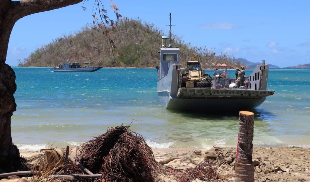 The New Zealand Defence Force brings relief equipment and aid supplies ashore at Lomaloma.