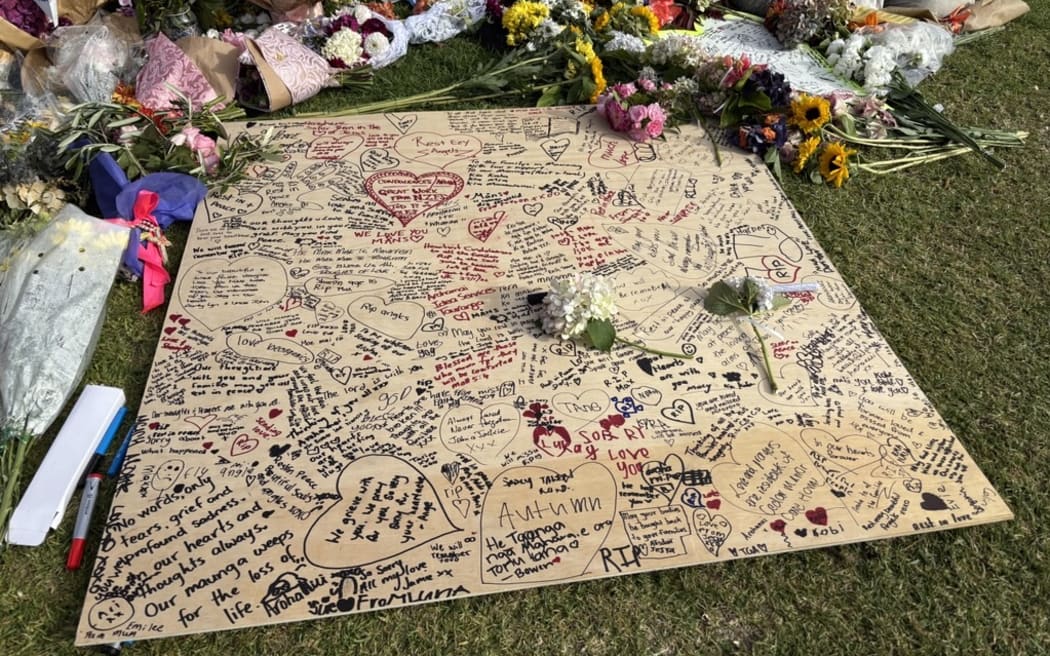 The cordon in Mount Maunganui following the deadly landslide is covered in tributes for the people who lost their lives.