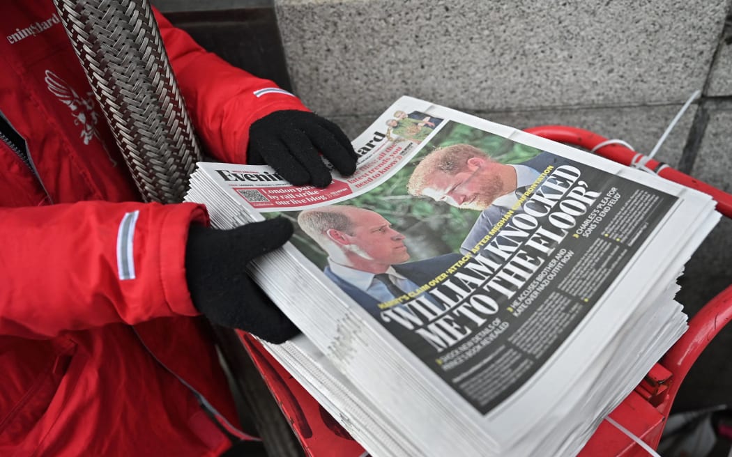 Copies of the Evening Standard newspaper, leading with stories about Prince Harry's relationship with  Prince William are placed out for distribution, in London on January 5, 2023, ahead of the publication of Britain's Prince Harry, Duke of Sussex's book, Spare. - Britain's Prince Harry recounts in his new book how he was physically "attacked" by his older brother Prince William during an argument in 2019, the Guardian reported on January 4, 2023. (Photo by JUSTIN TALLIS / AFP)