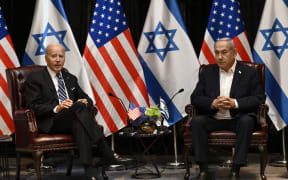 US President Joe Biden (L) listens to Israel's Prime Minister Benjamin Netanyahu as he joins a meeting of the Israeli war cabinet in Tel Aviv on October 18, 2023, amid the ongoing battles between Israel and the Palestinian group Hamas. US President Joe Biden landed in Tel Aviv on October 18, 2023 as Middle East anger flared after hundreds were killed when a rocket struck a hospital in war-torn Gaza, with Israel and the Palestinians quick to trade blame. (Photo by Brendan SMIALOWSKI / AFP)