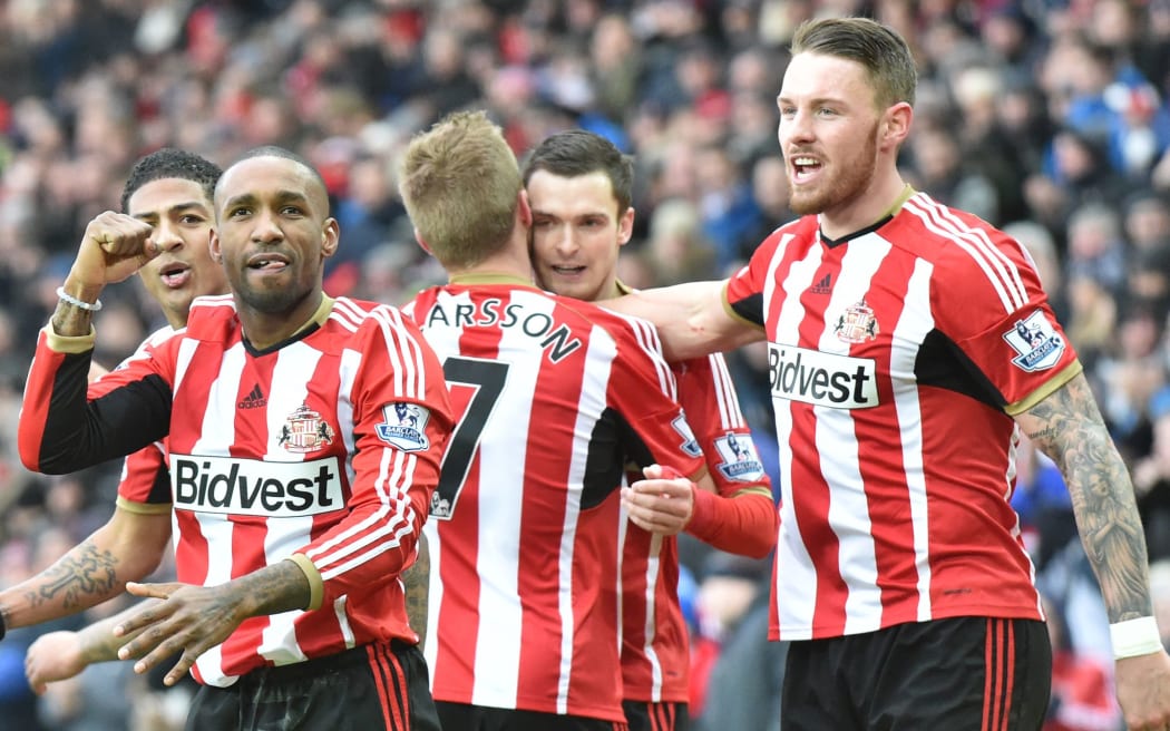 Sunderland players celebrate scoring a goal.