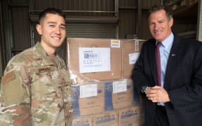 Ambassador Scott Brown (right) with Technical Sergeant Curtis Hoofman, U.S. Air Force