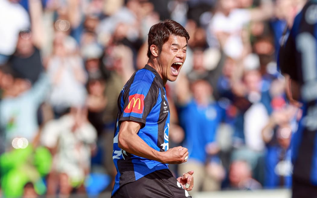 Auckland FC's Hiroki Sakai celebrates after Auckland go ahead following an own goal from a Brisbane defender.