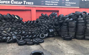Tyres dumped outside Super Cheap Auto in Onehunga