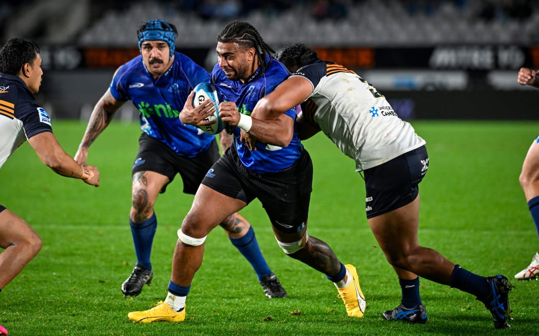 Blues forward Hoskins Sotutu is tackled during their Super Rugby Pacific semi-final against the Brumbies.