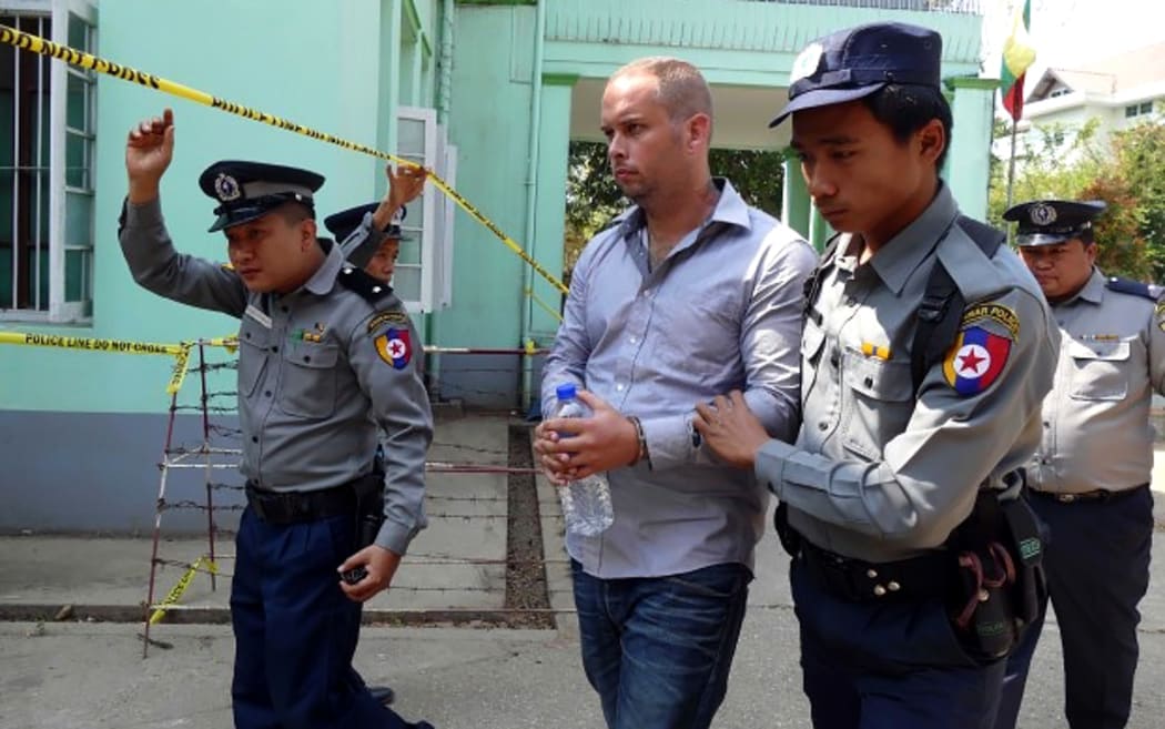 New Zealander Philip Blackwood being led into a court in Yangon, Myanmar.