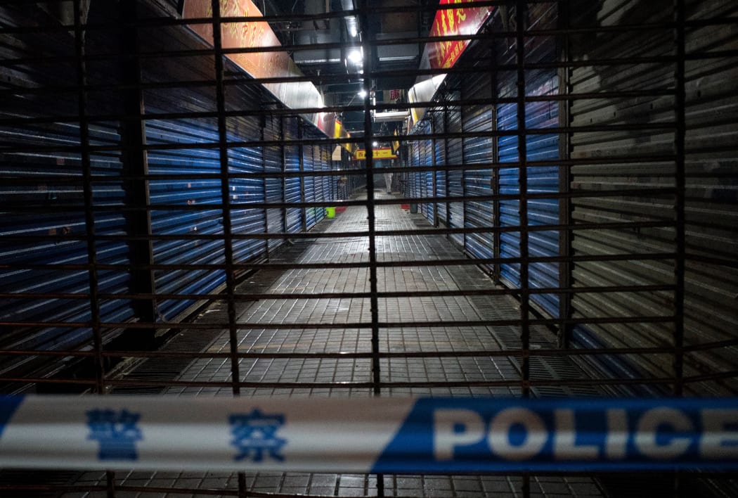 The Wuhan Hygiene Emergency Response Team conducts searches on the closed Huanan Seafood Wholesale Market in the Hubei Province, on January 11, 2020.