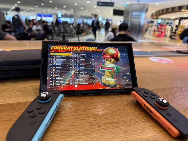 The writer gets some game time in tabletop mode while waiting for a flight at Sydney airport.