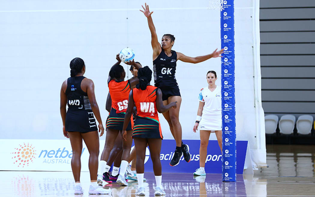 The Fiji Pearls (black kit) fell 54-47 to the Malawi Queens in their opening match on the Gold Coast.