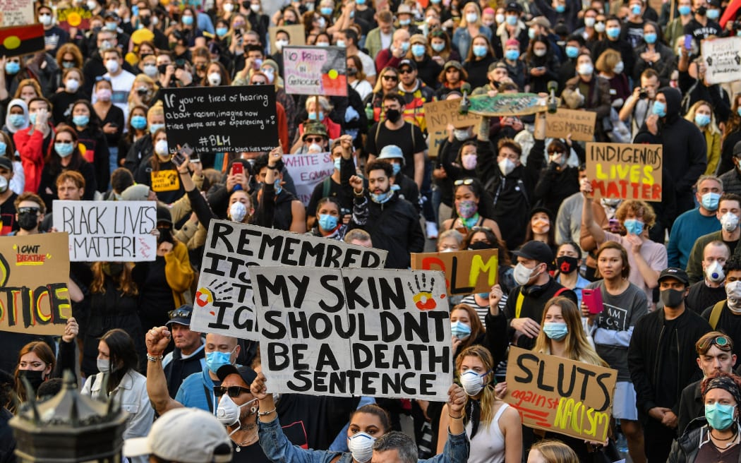 Demonstrators attend a Black Lives Matter protest to express solidarity with US protestors in Sydney on June 6, 2020 and demand an end to frequent Aboriginal deaths in custody in Australia.