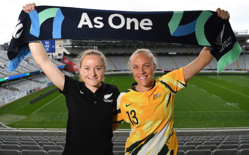 Paige Satchell and Tameka Yallop pose for a photo at Eden Park after New Zealand and Australia won the hosting rights to the 2023 FIFA Women's World Cup.