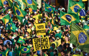 Participants and supporters of the government express their support for President Jair Bolsonaro during a demonstration in Busto de Tamandare in the city of Joao Pessoa, this Tuesday (7th) .