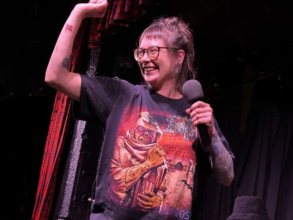 Anya Rzhevitskaya with her red flag, bearing the words "nice guy".