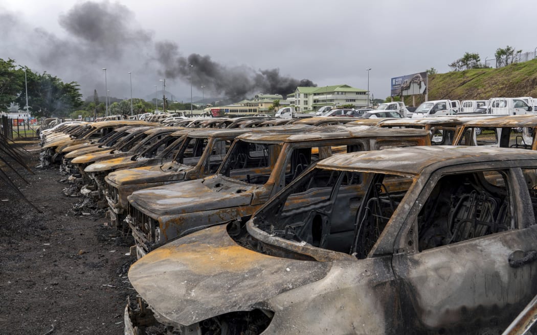 FILE - Burnt cars are lined up after unrest in Noumea, New Caledonia, on May 15, 2024. Global nickel prices have soared since deadly violence erupted in the French Pacific territory of New Caledonia. (AP Photo/Nicolas Job, File)