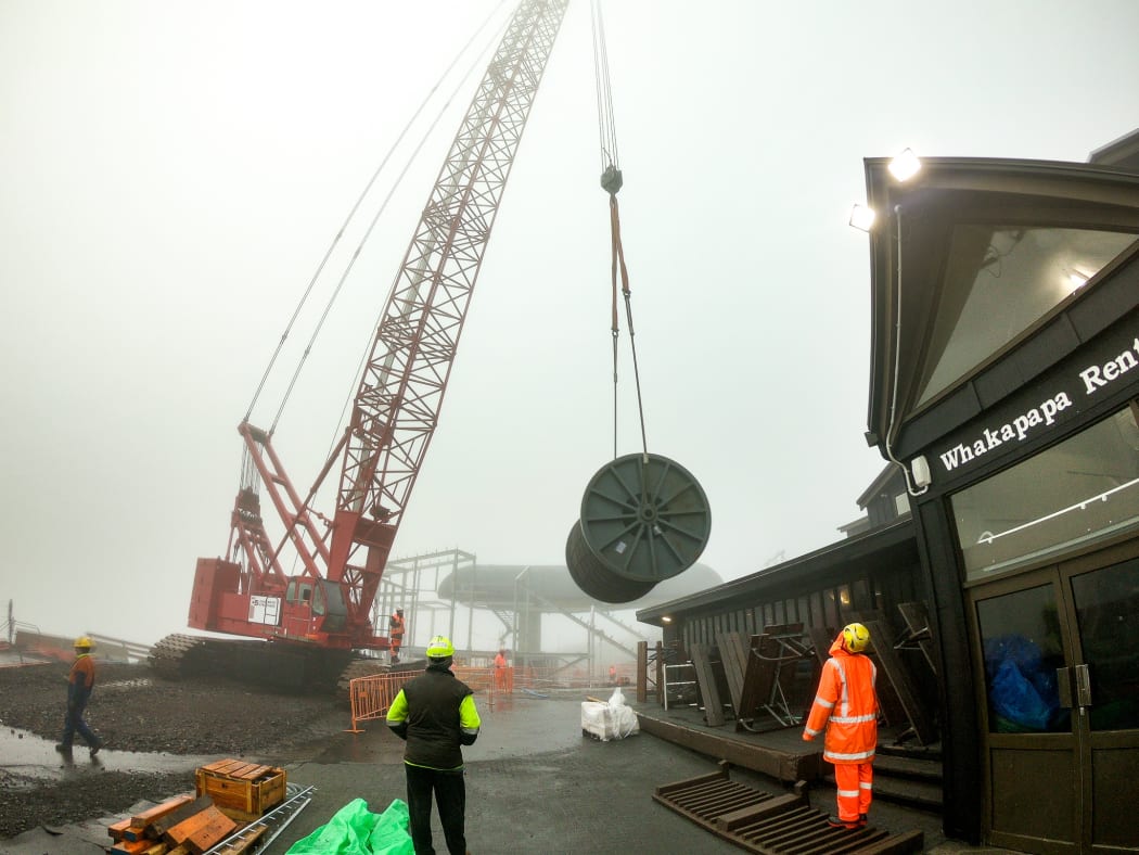 A 48,000kg spool for the gondola rope being lifted into place.