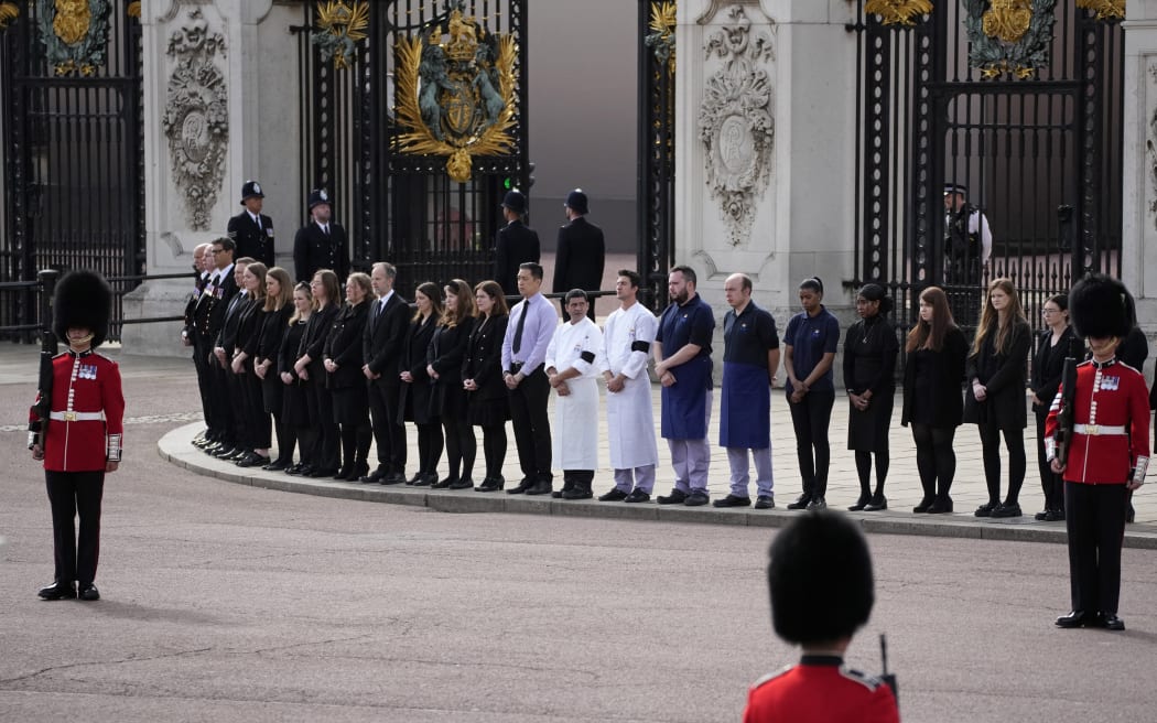 Buckingham Palace household staff pay their respects during the State Funeral of Queen Elizabeth II on September 19, 2022 in London, England.