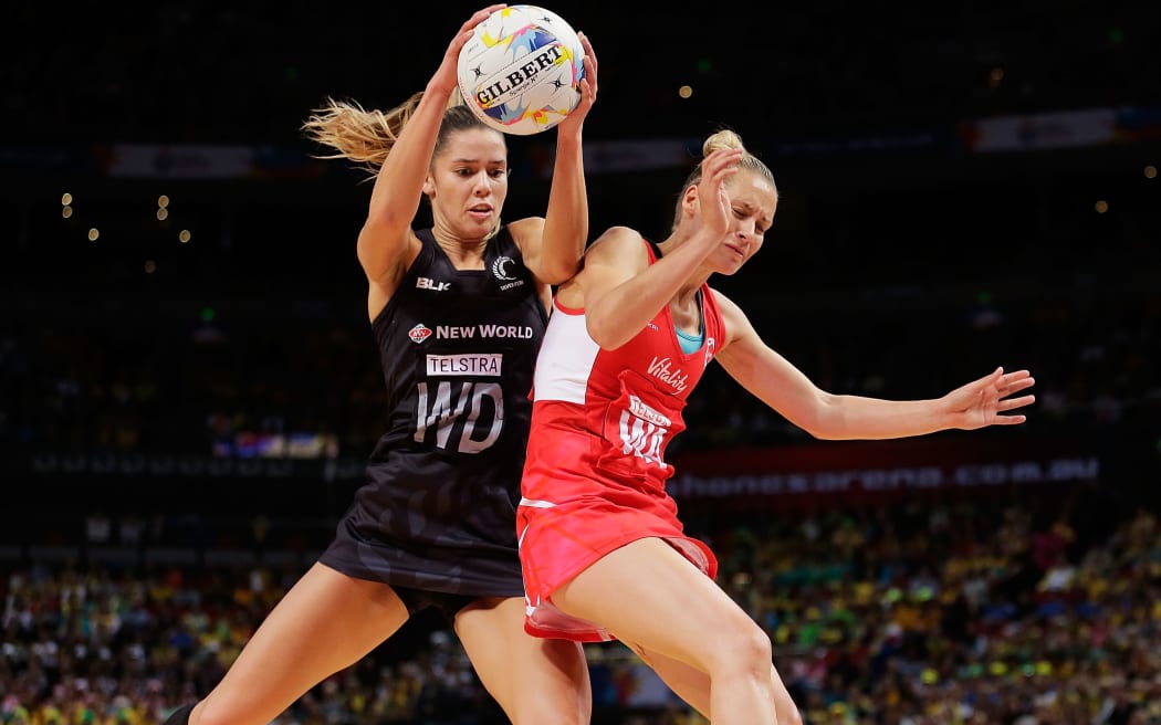 Silver Fern Kayla Cullen and Tamsin Greenway compete for the ball during the Netball World Cup semi final match between the Silver Ferns and England.