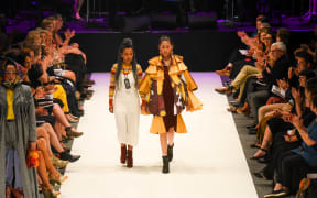 Tsega walks with her model at iD Fashion Week 2019 iD International Emerging Designer Awards. Regent Theatre, Dunedin, New Zealand. Friday 15 March 2019. Photo: Chris Sullivan/iD Dunedin