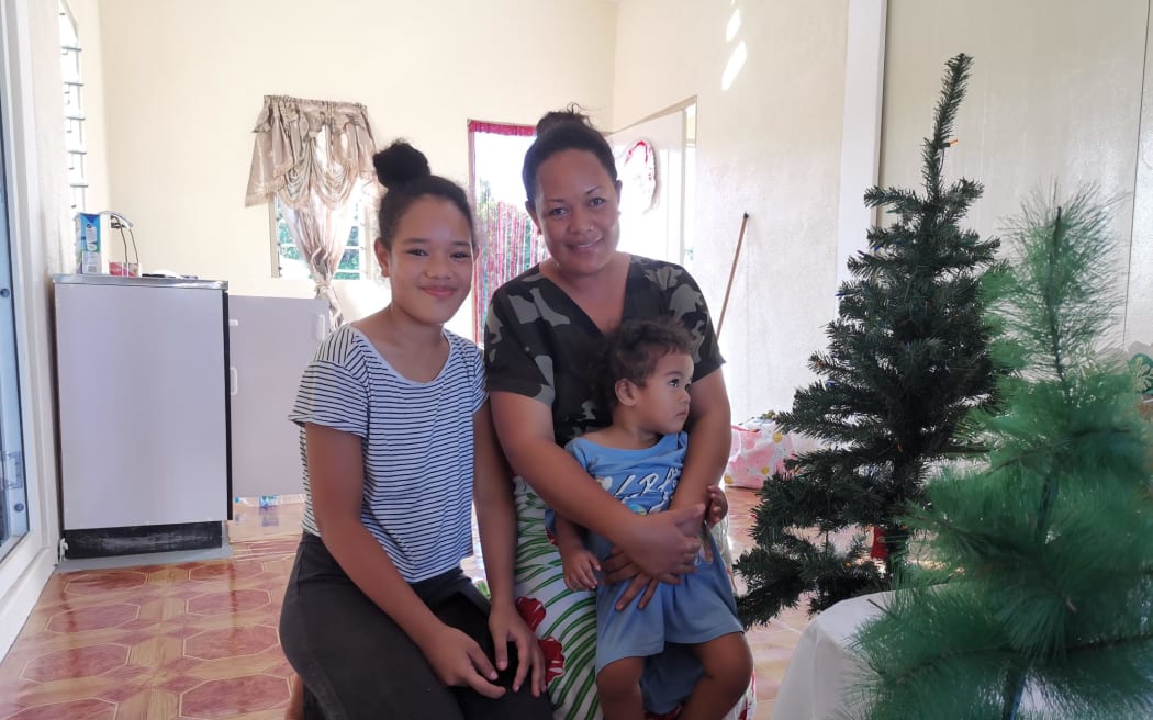 Kaufusi Vavekuki with children at new house in Masilamea