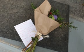 Flowers on the doorstep of the St Martin's house where Troy Dubrovskiy lived.