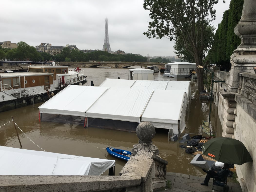 The scene near Pont Alexandre III on the Seine,where the rising waters have inundated riverside businesses.