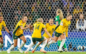 Steph Catley (7) of Australia scores from the penalty spot and celebrates during their World Cup 1-nil win over Ireland.