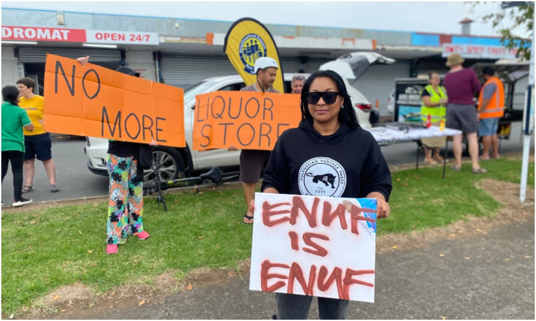 Shirl'e Fruean and other Māngere residents protesting outside the proposed Vine Street liquor store.