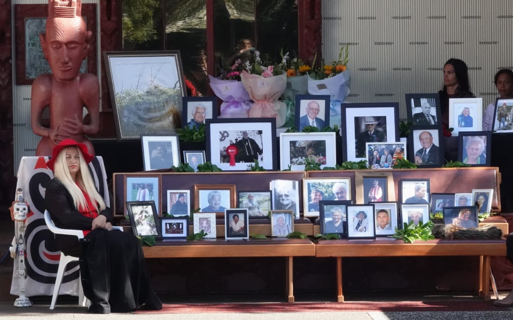 Photos of Tribunal members and claimants who did not live to see the final report are displayed on the porch of Te Whare Rūnanga.