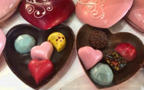 Decorative Belgian chocolate truffles in heart-shaped boxes made of chocolate at a sweet shop in the historic town of Unionville, Ontario, Canada.