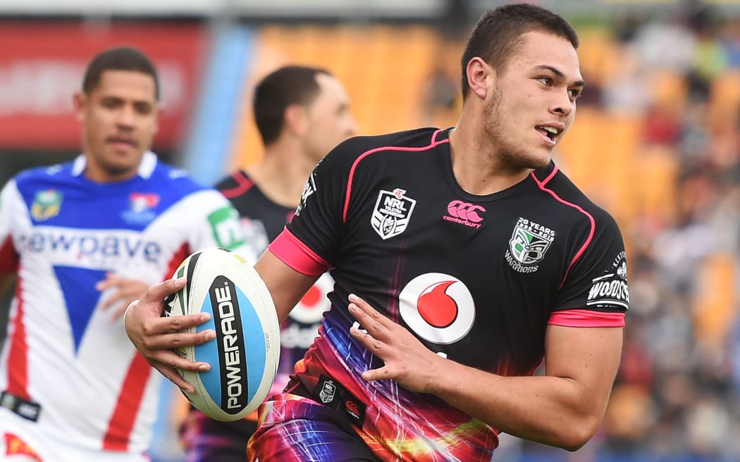 Tuimoala Lolohea on the way to scoring a try against Newcastle, 2015.
