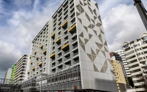Scene One apartments on Beach Rd, Auckland was plunged into darkness for days after a major power malfunction. Photo / Michael Craig