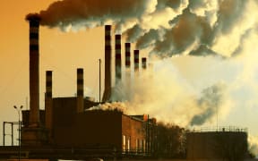 A file photo representing industry emissions, showing factory smoke.