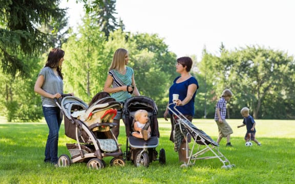 happy mothers with strollers