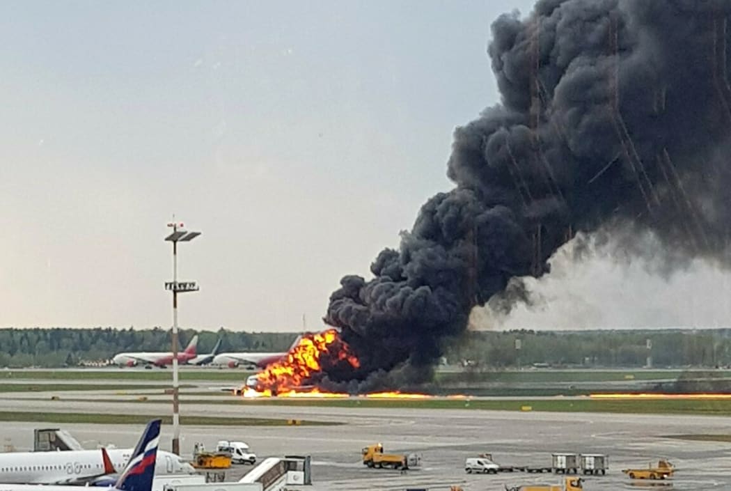 In this image provided by Riccardo Dalla Francesca shows smoke rises from a fire on a plane at Moscow's Sheremetyevo airport on Sunday, May 5, 2019.
