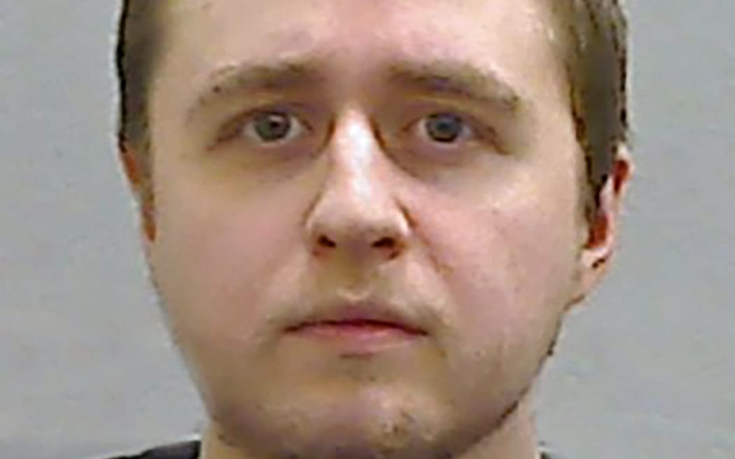 This undated handout custody photograph released by Police Service of Northern Ireland (PSNI) on October 25, 2024, shows Alexander McCartney, who admitted 185 charges involving 70 children, posed as a teenage girl to befriend young females across the world on Snapchat before blackmailing them. - A prolific "catfish" offender who pushed one of his victims, a 12-year-old US girl, to commit suicide was on Friday jailed for life at a court in Northern Ireland. (Photo by PSNI / AFP) / RESTRICTED TO EDITORIAL USE - MANDATORY CREDIT "AFP PHOTO / PSNI " - NO MARKETING NO ADVERTISING CAMPAIGNS - DISTRIBUTED AS A SERVICE TO CLIENTS