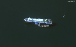 (FILES) This handout satellite picture released by Maxar Technologies on November 28, 2023, shows the recently seized Isreali-linked Galaxy Leader ship, that was captured by Huthi fighters on November 19, next to a support vessel in the southern Red Sea near Hodeida, Yemen. Heavy air strikes pounded rebel-held cities in Yemen early on January 12, 2024, according to the Huthi rebels' official media and AFP correspondents. The capital Sanaa, Hodeida and Saada were all targeted, the Huthis' official media said, blaming "American aggression with British participation". (Photo by Satellite image ©2023 Maxar Technologies / AFP) / RESTRICTED TO EDITORIAL USE - MANDATORY CREDIT "AFP PHOTO / Satellite image ©2023 Maxar Technologies" - NO MARKETING NO ADVERTISING CAMPAIGNS - DISTRIBUTED AS A SERVICE TO CLIENTS - THE WATERMARK MAY NOT BE REMOVED/CROPPED -