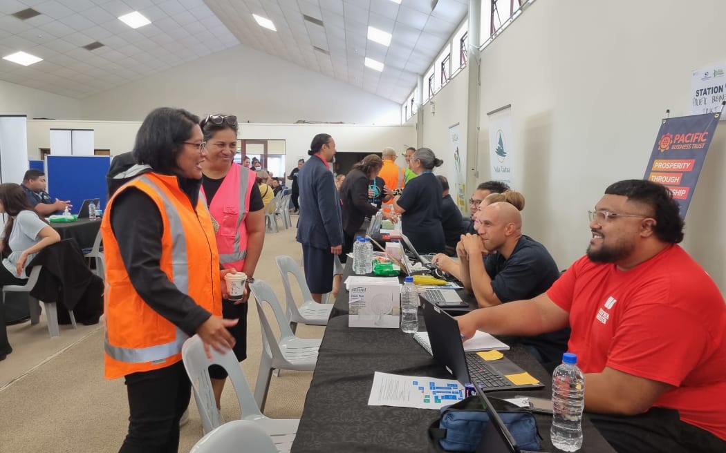 Minister for Pacific Peoples Barbara Edmonds (in high-viz vest) talks to people at the Mangere Community Hub.