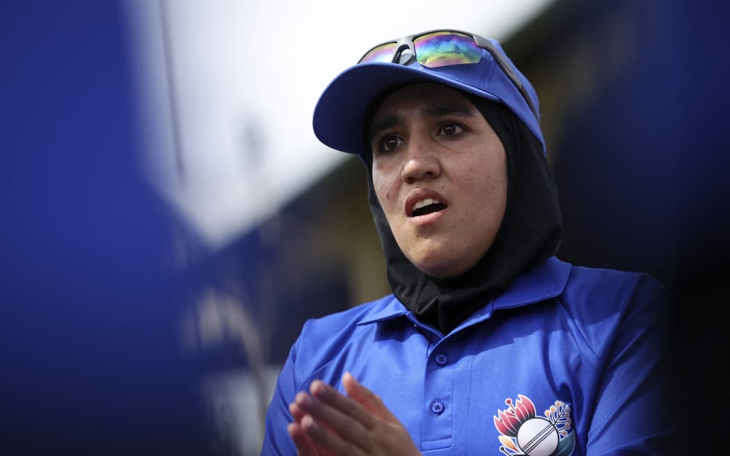 Nahida Sapan, captain of Afghanistan Women's XI, talks to her teammates during the cricket match against Cricket Without Borders XI at Junction Oval in Melbourne on January 30, 2025.