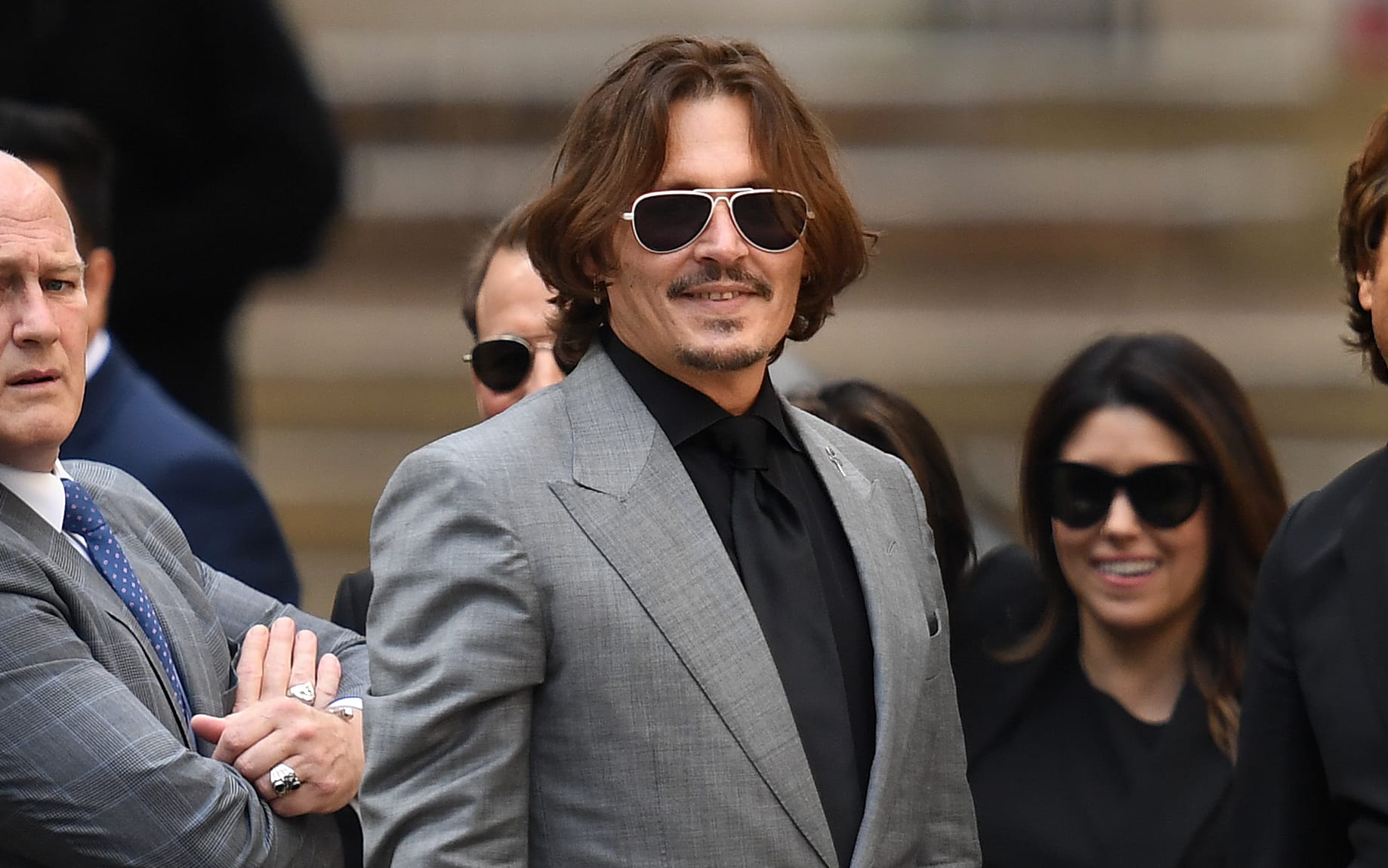 US actor Johnny Depp gestures as he leaves the High Court after the final day of his libel trial against News Group Newspapers (NGN), in London, on July 28, 2020.