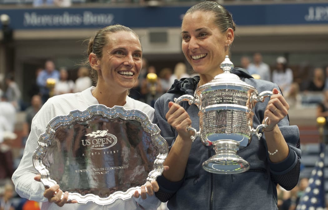 Roberta Vinci and Flavia Pennetta pose with trophies.