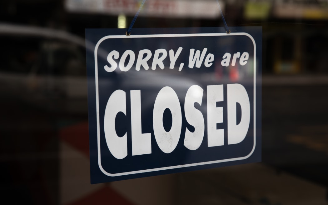 Sign that reads 'Sorry, We are closed' hanging in a shop front in Central Auckland during Lockdown Level 3.